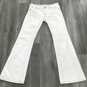 YNQ Denim,  Flare Cut distressed 5 pocket. Brown stitching accents. Size 5